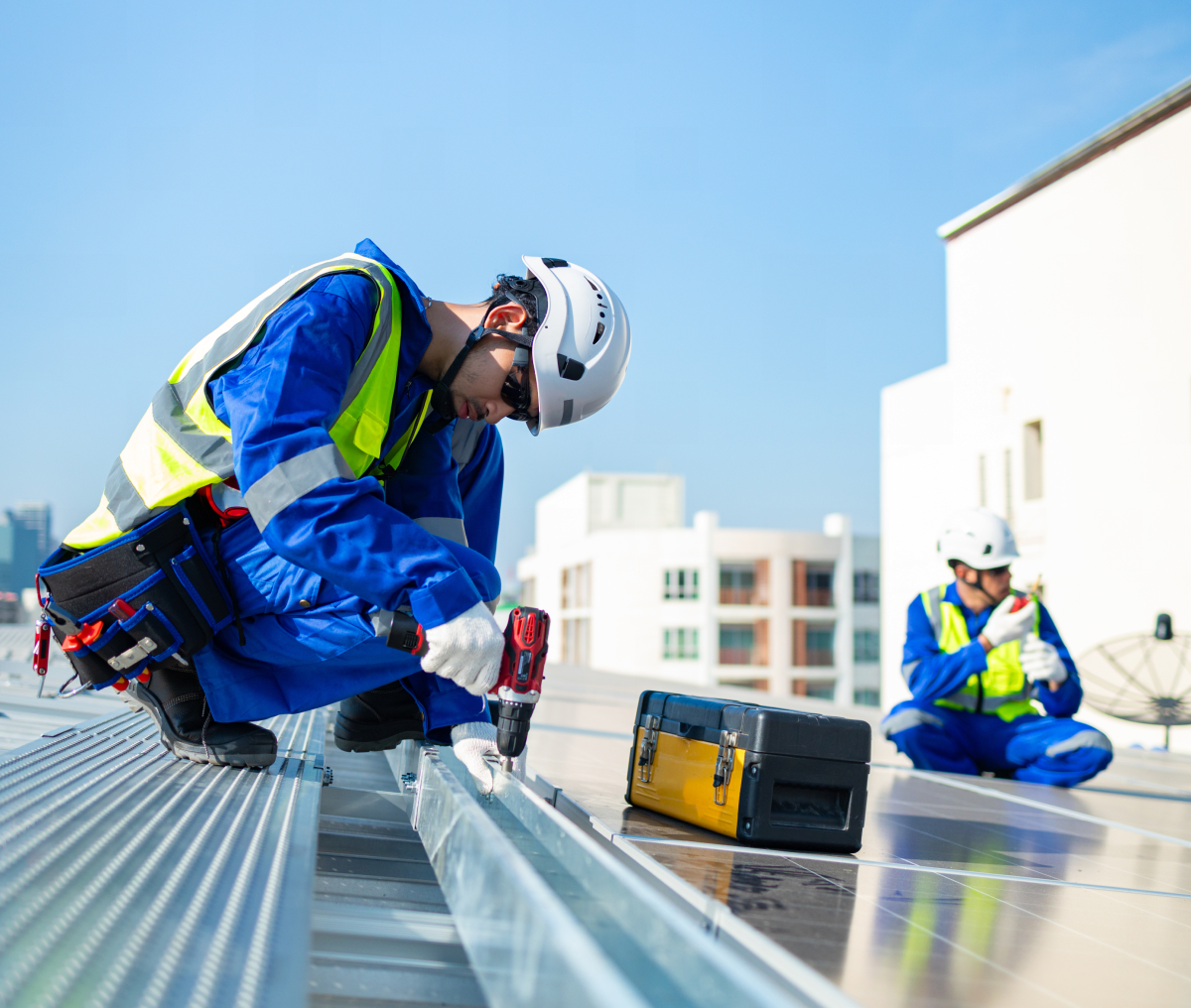 Solar panel installation teamwork on building